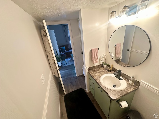 1175 S Canyon Rd E Unit 81, Ogden, UT 84404 - bathroom with a textured ceiling, vanity, and wood finished floors