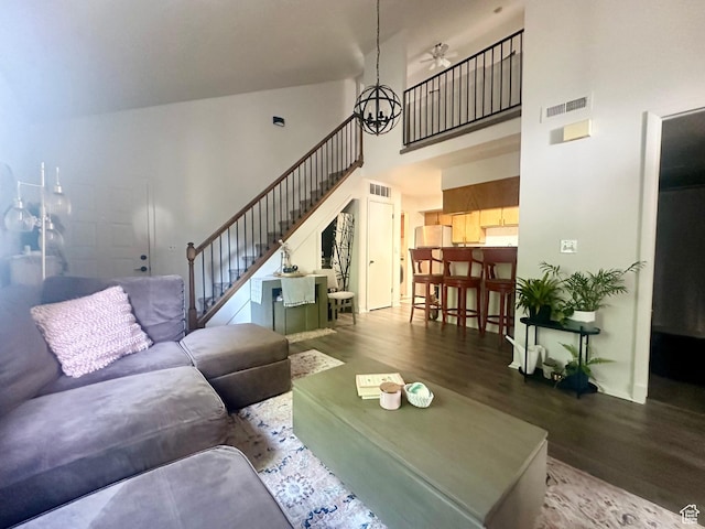1175 S Canyon Rd E Unit 81, Ogden, UT 84404 - living area featuring wood finished floors, a towering ceiling, stairs, and ceiling fan