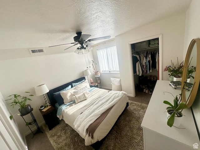 1175 S Canyon Rd E Unit 81, Ogden, UT 84404 - carpeted bedroom with a closet, a walk in closet, ceiling fan, a textured ceiling, and baseboards