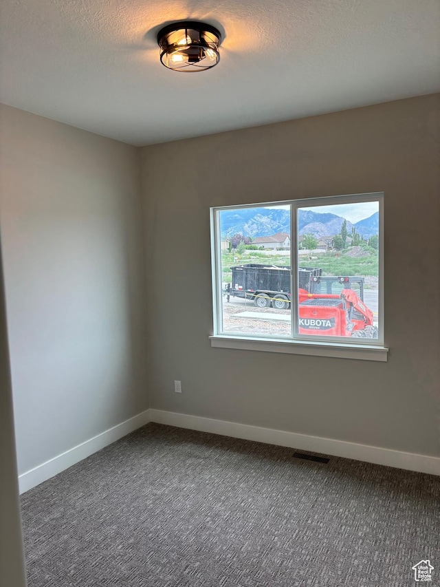 3323 N 1200 W, Pleasant View, UT 84414 - carpeted empty room featuring baseboards and a textured ceiling