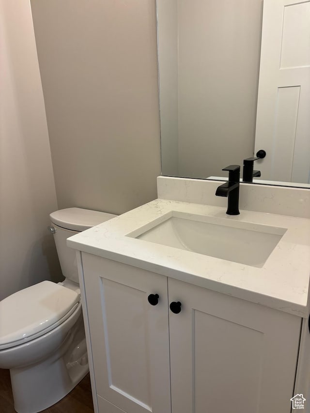 3323 N 1200 W, Pleasant View, UT 84414 - half bathroom featuring vanity and wood finished floors