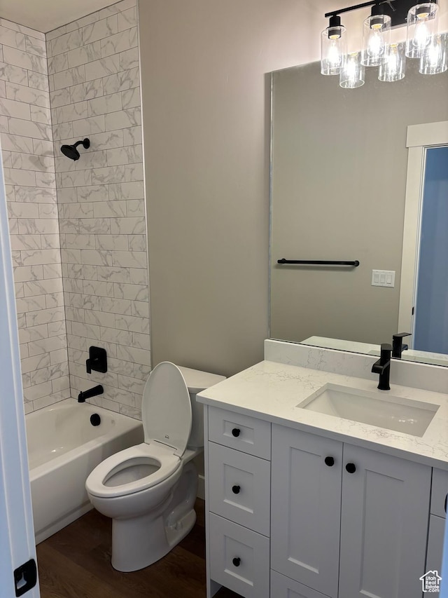 3323 N 1200 W, Pleasant View, UT 84414 - bathroom with vanity, wood finished floors, and shower / washtub combination