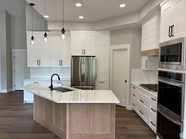 3323 N 1200 W, Pleasant View, UT 84414 - kitchen featuring stainless steel appliances, an island with sink, decorative backsplash, dark wood-style floors, and recessed lighting