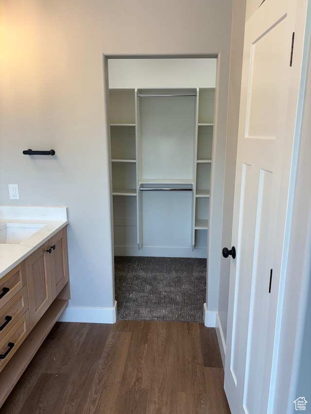 3323 N 1200 W, Pleasant View, UT 84414 - bathroom with vanity, wood finished floors, and a walk in closet
