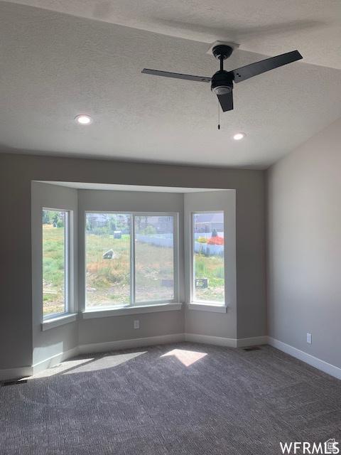3323 N 1200 W, Pleasant View, UT 84414 - carpeted empty room with baseboards, a textured ceiling, a ceiling fan, and recessed lighting