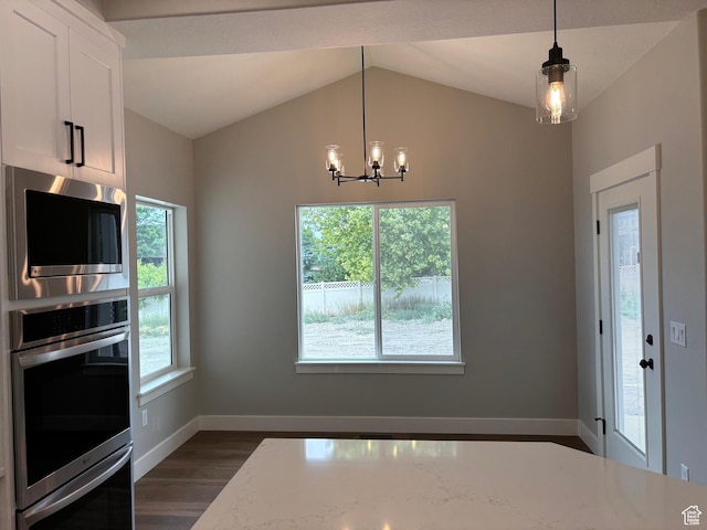 3323 N 1200 W, Pleasant View, UT 84414 - unfurnished dining area featuring dark wood finished floors, a chandelier, and vaulted ceiling