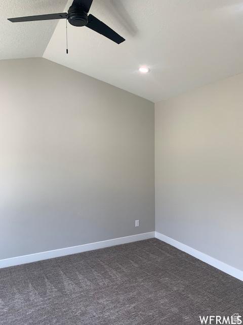 3323 N 1200 W, Pleasant View, UT 84414 - empty room featuring a ceiling fan, dark colored carpet, baseboards, recessed lighting, and vaulted ceiling
