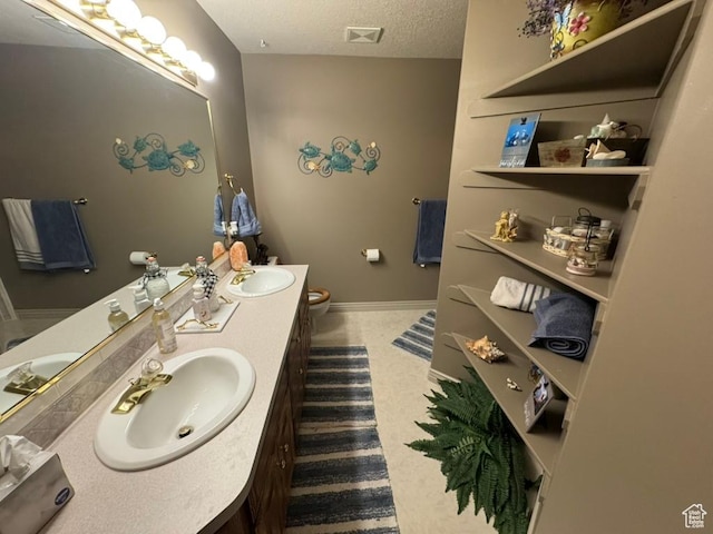 4862 S Kiwana Dr, South Ogden, UT 84403 - full bath with double vanity and a textured ceiling