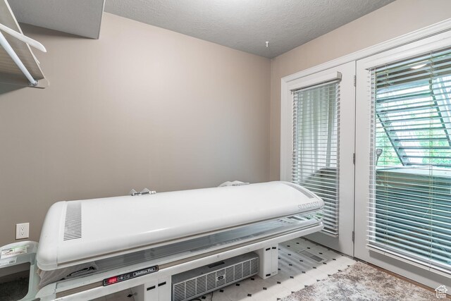 4862 S Kiwana Dr, South Ogden, UT 84403 - misc room featuring plenty of natural light and a textured ceiling