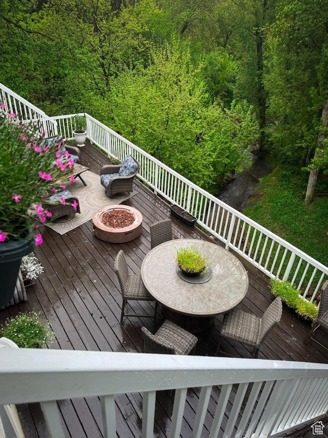 4862 S Kiwana Dr, South Ogden, UT 84403 - deck with a fire pit and a forest view