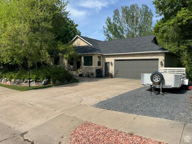4862 S Kiwana Dr, South Ogden, UT 84403 - ranch-style house with concrete driveway and a garage