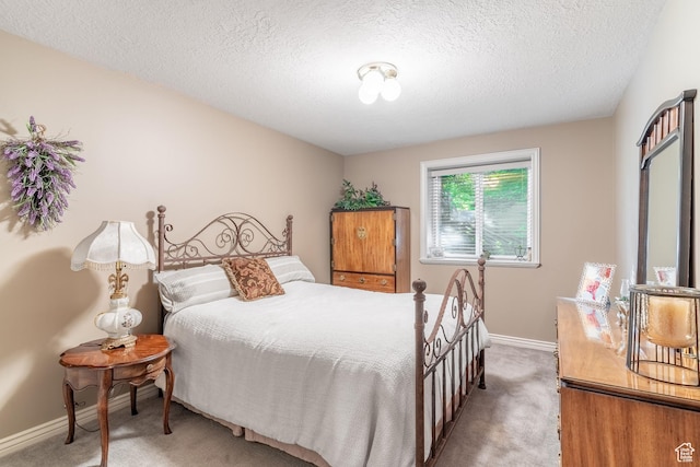 4862 S Kiwana Dr, South Ogden, UT 84403 - bedroom with light colored carpet, baseboards, and a textured ceiling