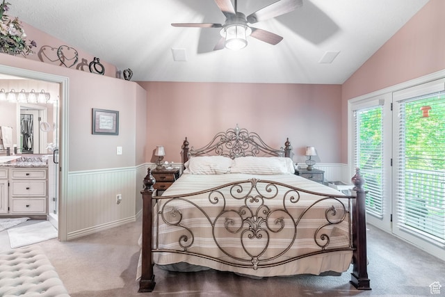 4862 S Kiwana Dr, South Ogden, UT 84403 - bedroom featuring vaulted ceiling, access to exterior, wainscoting, light colored carpet, and ensuite bath