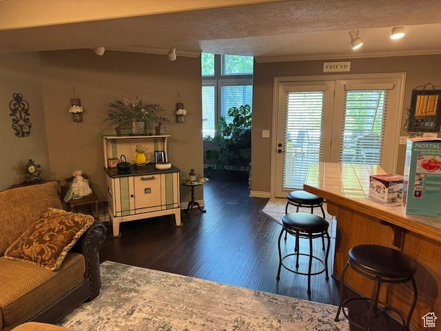 4862 S Kiwana Dr, South Ogden, UT 84403 - dining area with crown molding and dark wood-style floors