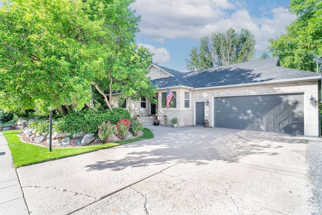 4862 S Kiwana Dr, South Ogden, UT 84403 - ranch-style house featuring a garage, driveway, and brick siding