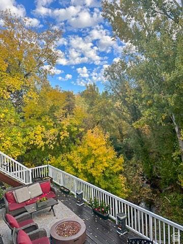 4862 S Kiwana Dr, South Ogden, UT 84403 - wooden terrace featuring a fire pit
