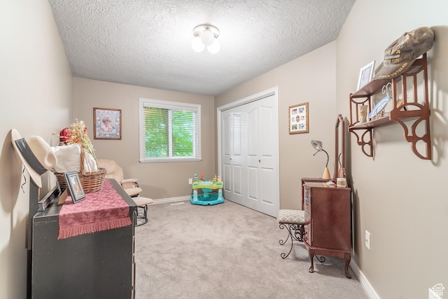 4862 S Kiwana Dr, South Ogden, UT 84403 - living area with carpet floors, a textured ceiling, and baseboards