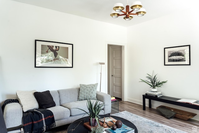 19 S 800 E Unit 3, Salt Lake City, UT 84102 - living room featuring a chandelier, wood finished floors, and baseboards