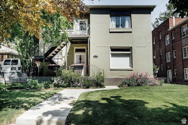 19 S 800 E Unit 3, Salt Lake City, UT 84102 - view of front of home featuring a front lawn and brick siding