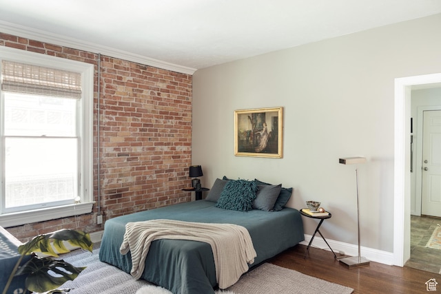 19 S 800 E Unit 3, Salt Lake City, UT 84102 - bedroom with wood finished floors, multiple windows, brick wall, baseboards, and ornamental molding