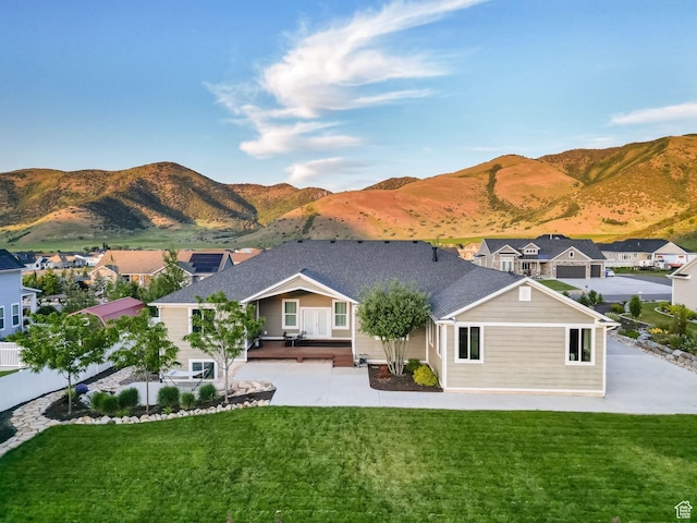 588 S 100 E, Mantua, UT 84324 - back of property featuring a patio, a yard, a mountain view, and a residential view