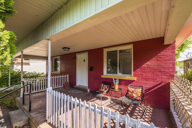1240 W Indiana Ave, Salt Lake City, UT 84104 - doorway to property with covered porch and brick siding