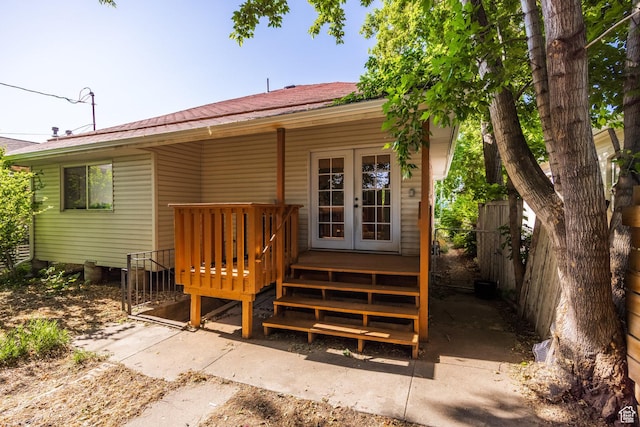 1240 W Indiana Ave, Salt Lake City, UT 84104 - back of property with a wooden deck, metal roof, and french doors