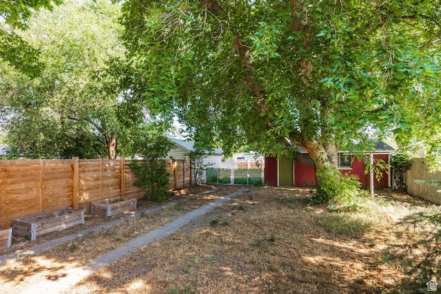 1240 W Indiana Ave, Salt Lake City, UT 84104 - fenced backyard featuring an outbuilding