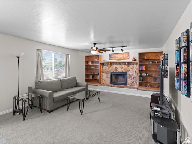 164 S 400 E, Fairview, UT 84629 - carpeted living area with a fireplace, ceiling fan, and baseboards