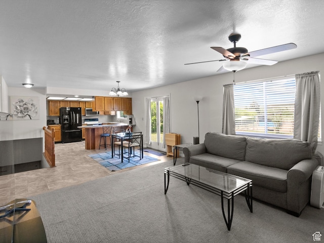 164 S 400 E, Fairview, UT 84629 - living area with a chandelier, ceiling fan, and a textured ceiling