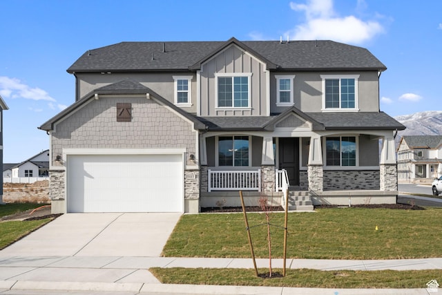 5443 N Cliffrose Dr Unit 637, Eagle Mountain, UT 84005 - craftsman-style home featuring stone siding, covered porch, concrete driveway, a front yard, and an attached garage