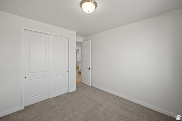 5443 N Cliffrose Dr Unit 637, Eagle Mountain, UT 84005 - unfurnished bedroom featuring carpet, a closet, and baseboards