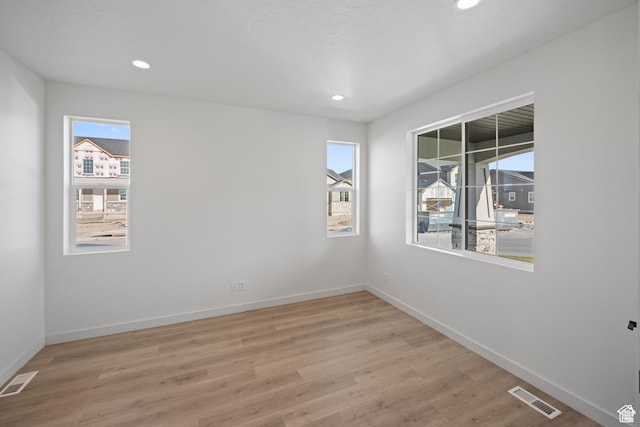 5443 N Cliffrose Dr Unit 637, Eagle Mountain, UT 84005 - empty room featuring light wood finished floors, baseboards, and recessed lighting