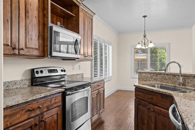 923 W 965 N, Orem, UT 84057 - kitchen with stainless steel appliances, a sink, healthy amount of natural light, dark wood-style flooring, and crown molding