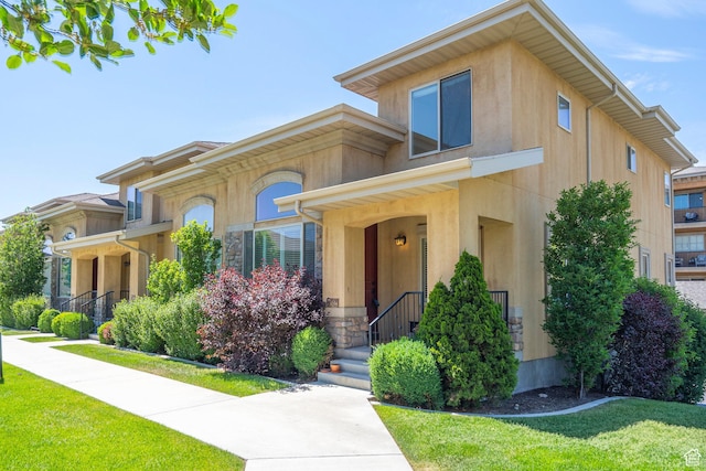 923 W 965 N, Orem, UT 84057 - view of front of house with stone siding, a front yard, and stucco siding
