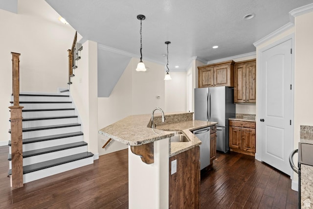 923 W 965 N, Orem, UT 84057 - kitchen featuring a sink, appliances with stainless steel finishes, brown cabinets, dark wood finished floors, and ornamental molding
