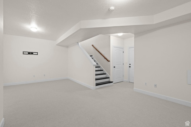 923 W 965 N, Orem, UT 84057 - finished basement featuring light colored carpet, a textured ceiling, baseboards, and stairway