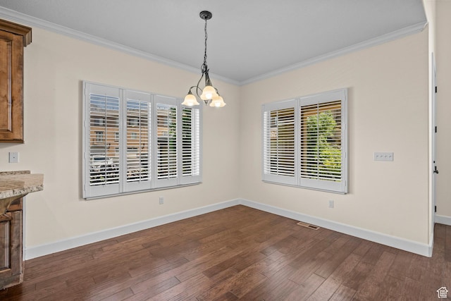923 W 965 N, Orem, UT 84057 - unfurnished dining area with ornamental molding, a chandelier, healthy amount of natural light, baseboards, and dark wood-style flooring
