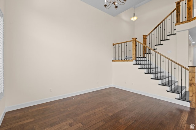 923 W 965 N, Orem, UT 84057 - staircase with hardwood / wood-style floors, a chandelier, baseboards, and a high ceiling