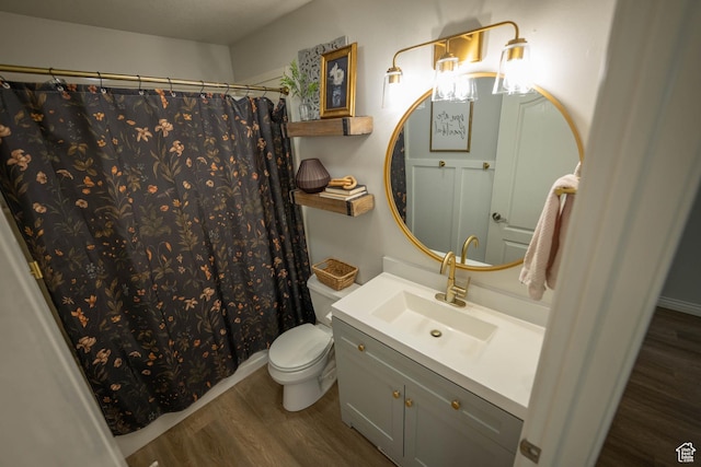 1536 E Mountain Rd, Logan, UT 84321 - bathroom featuring wood finished floors, toilet, vanity, and a shower with curtain