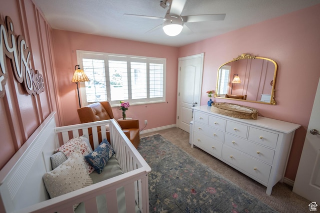 1536 E Mountain Rd, Logan, UT 84321 - bedroom featuring light carpet, baseboards, and a ceiling fan