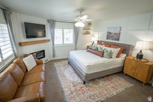 1536 E Mountain Rd, Logan, UT 84321 - carpeted bedroom with ceiling fan and a large fireplace