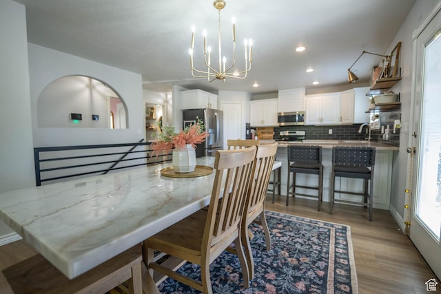 1536 E Mountain Rd, Logan, UT 84321 - dining space featuring light wood finished floors, a chandelier, and recessed lighting
