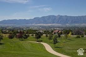 1536 E Mountain Rd, Logan, UT 84321 - view of community featuring a mountain view, view of golf course, and a yard