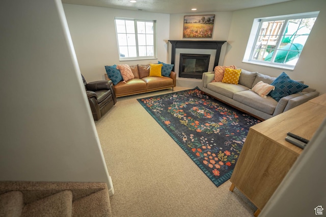 1536 E Mountain Rd, Logan, UT 84321 - living area with carpet flooring, a tiled fireplace, and recessed lighting