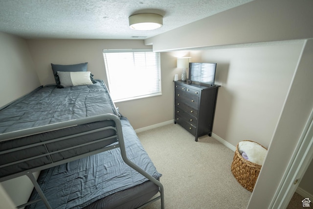 1536 E Mountain Rd, Logan, UT 84321 - bedroom featuring light colored carpet, baseboards, and a textured ceiling