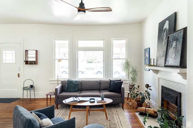 336 S Douglas St S, Salt Lake City, UT 84102 - living room with wood finished floors, ceiling fan, a brick fireplace, and baseboards