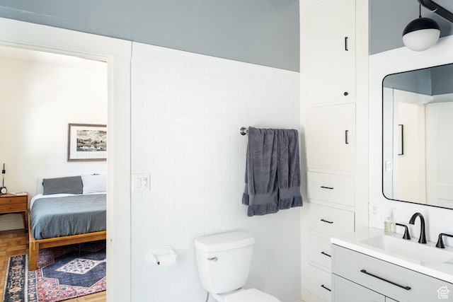 336 S Douglas St S, Salt Lake City, UT 84102 - bathroom featuring vanity, ensuite bath, and toilet