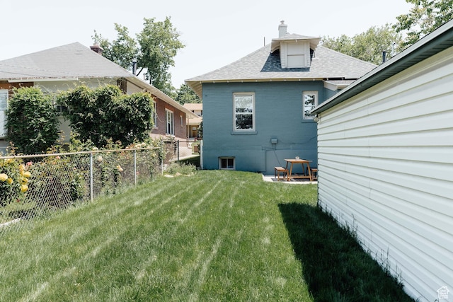 336 S Douglas St S, Salt Lake City, UT 84102 - rear view of property featuring a shingled roof, a chimney, and brick siding
