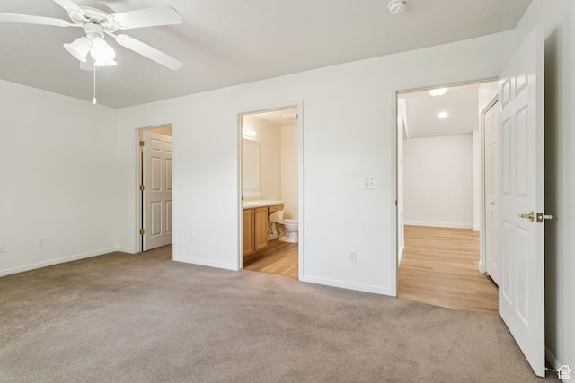 9362 S Abbey View Rd W, West Jordan, UT 84088 - unfurnished bedroom with light colored carpet, baseboards, ensuite bathroom, and a ceiling fan